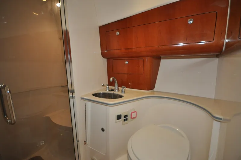 Slide: The Image of Luxurious bathroom interior of 2009 Intrepid 430 Sport Yacht with wooden cabinetry. - 16