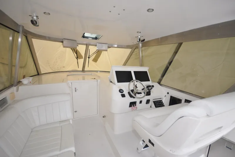Slide: The Image of Interior of 2009 Intrepid 430 Sport Yacht with helm and seating area. - 19