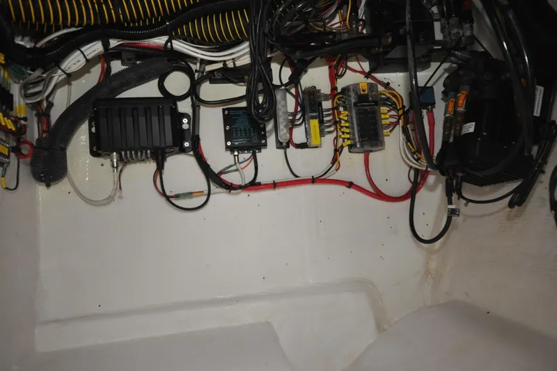 Slide: The Image of Electrical wiring and components inside a 2009 Intrepid 430 Sport Yacht. - 27