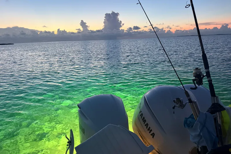 Slide: The Image of Sunset view from 2009 Intrepid 430 Sport Yacht with Yamaha engines and fishing rods. - 32
