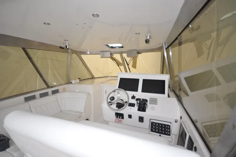 Slide: The Image of Interior view of 2009 Intrepid 430 Sport Yacht cockpit with steering wheel and control panels. - 6