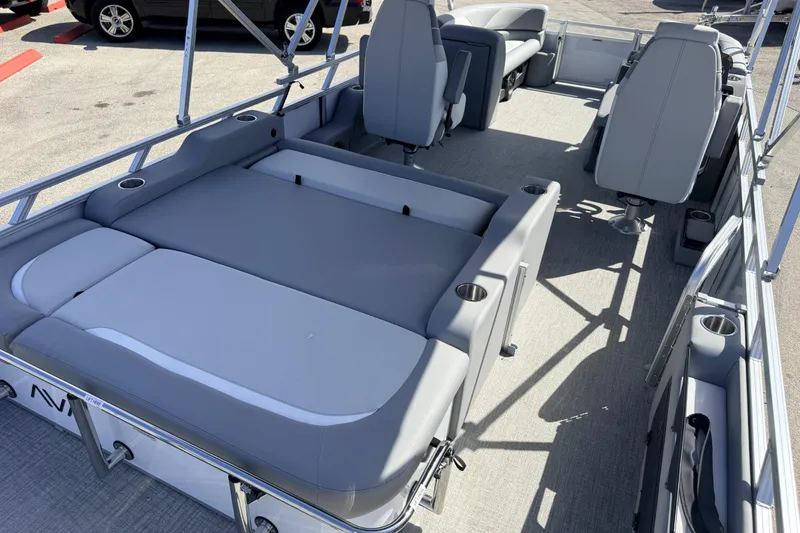 Slide: The Image of 2026 Avalon 2385 Venture 85 VRB Tri Toon boat interior with gray seating and cup holders. - 10