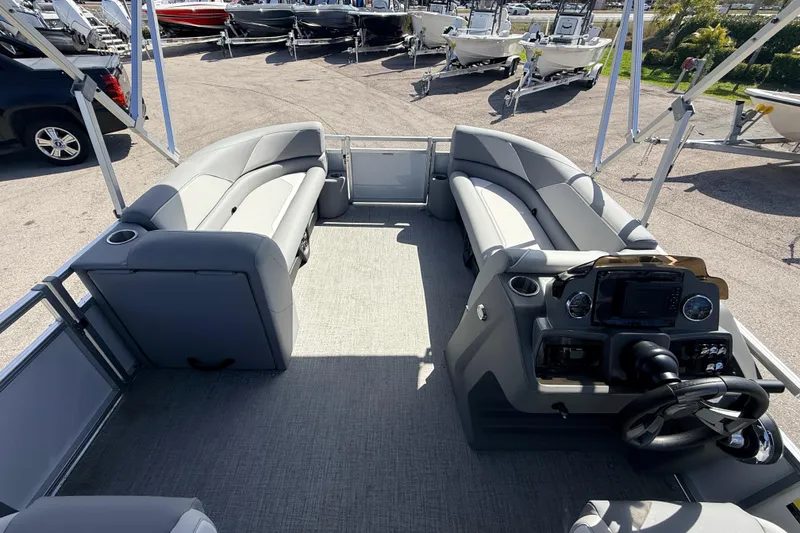 Slide: The Image of 2026 Avalon 2385 Venture 85 VRB Tri Toon boat interior with modern seating and control panel. - 13
