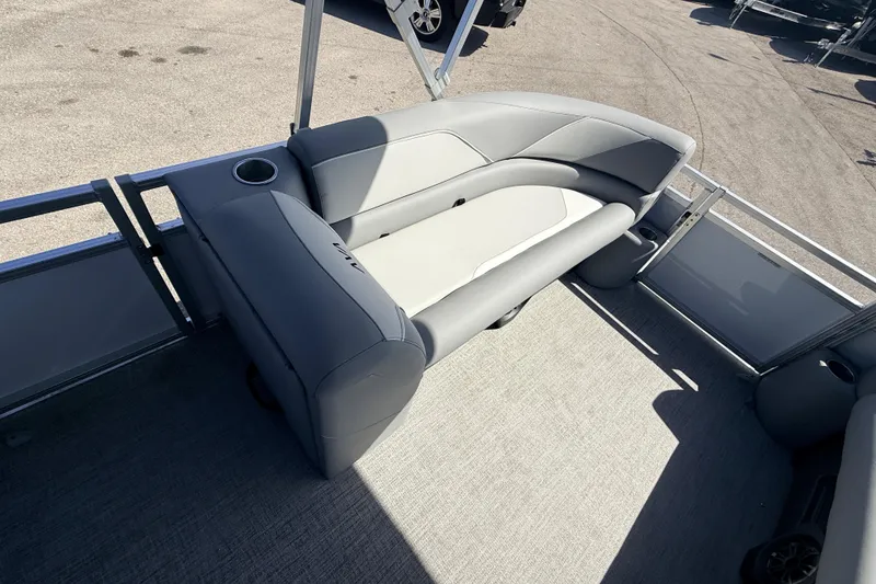 Slide: The Image of 2026 Avalon 2385 Venture 85 VRB Tri Toon boat interior with gray seating and cup holders. - 14