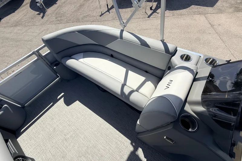 Slide: The Image of 2026 Avalon 2385 Venture 85 VRB Tri Toon boat interior with gray seating and cup holders. - 15