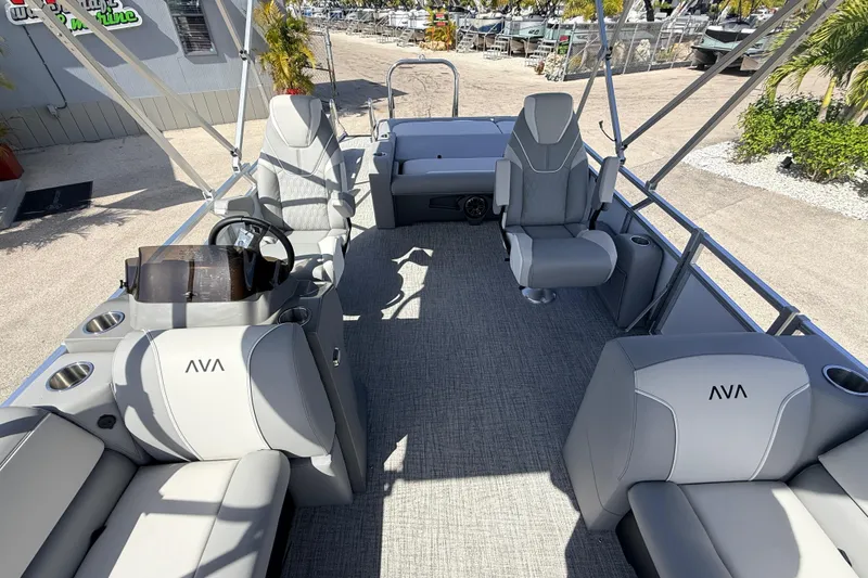 Slide: The Image of 2026 Avalon 2385 Venture 85 VRB Tri Toon boat interior with modern seating and steering console. - 16