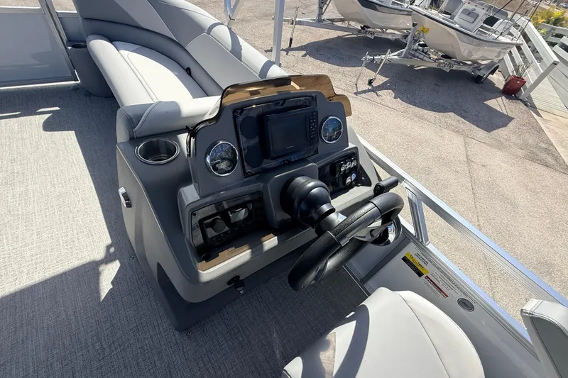 Slide: The Image of 2026 Avalon 2385 Venture 85 VRB boat dashboard with steering wheel and controls. - 20