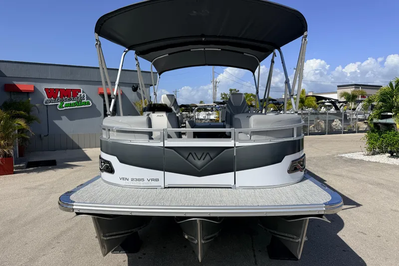 Slide: The Image of 2026 Avalon 2385 Venture VRB Tri Toon boat with canopy at dealership. - 4