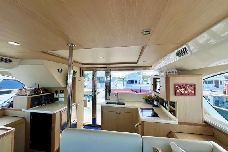 Slide: The Image of Interior of 2020 Aquila 44 Yacht with modern kitchen and panoramic windows. - 10