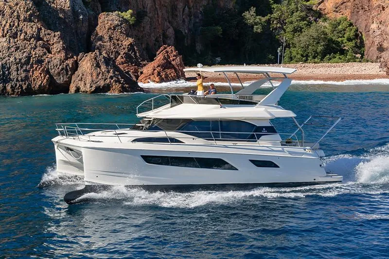 Slide: The Image of Manufacturer Provided Image: 2020 Aquila 44 Yacht cruising near rocky coastline. - 14