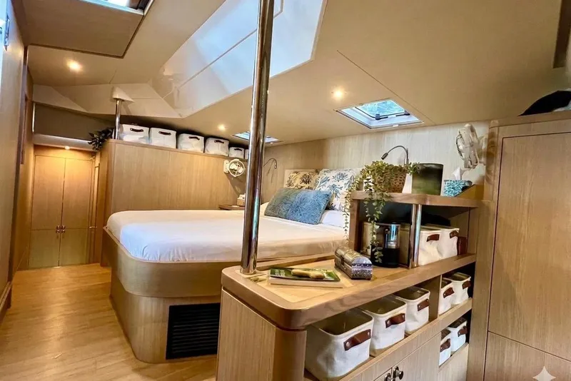 Slide: The Image of Luxurious interior of 2020 Aquila 44 Yacht with cozy bedroom and elegant storage solutions. - 5