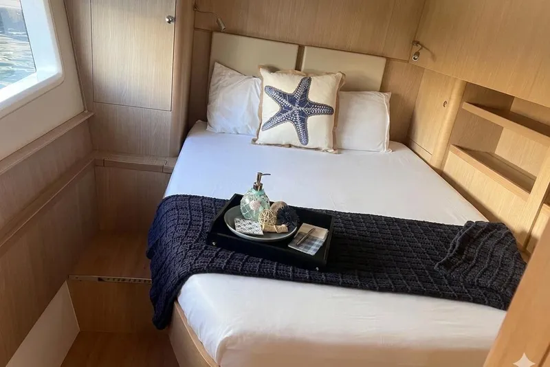 Slide: The Image of Luxurious bedroom interior of 2020 Aquila 44 Yacht with cozy bedding and decor. - 6