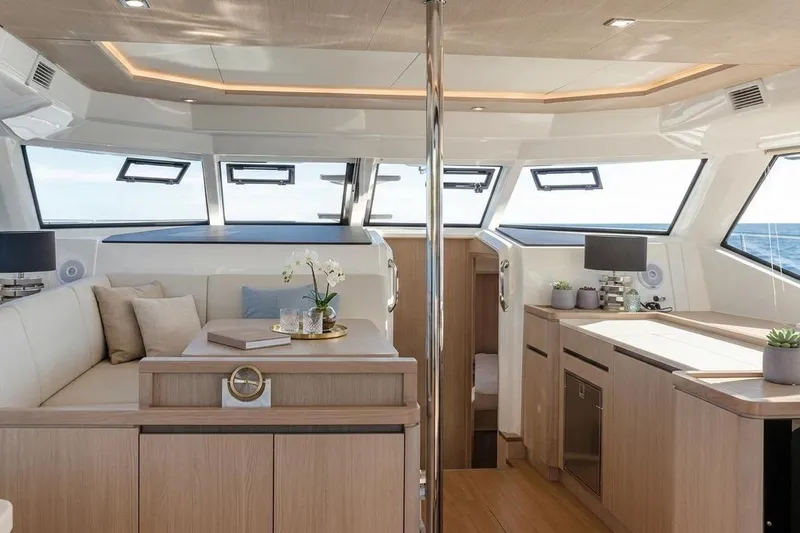 Slide: The Image of Luxurious interior of 2020 Aquila 44 Yacht with modern furnishings and panoramic windows. - 8