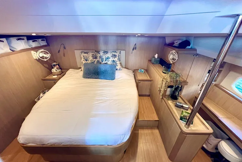 Slide: The Image of Luxurious bedroom interior of 2020 Aquila 44 Yacht with modern decor and cozy bedding. - 9