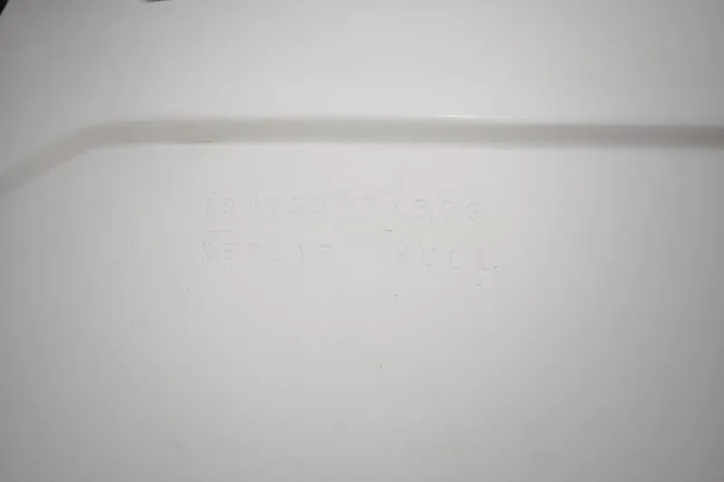 Slide: The Image of Embossed text on white surface of 2009 Intrepid 430 Sport Yacht Kevlar hull. - 22