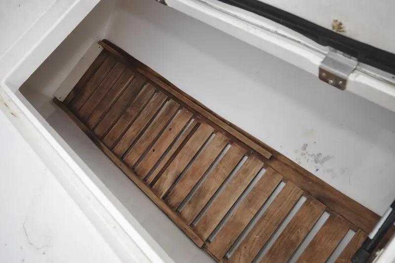 Slide: The Image of Storage compartment with wooden slats on a 2009 Intrepid 430 Sport Yacht. - 23