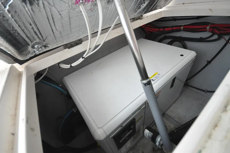 Slide: The Image of Engine compartment of 2009 Intrepid 430 Sport Yacht with visible wiring and equipment. - 26