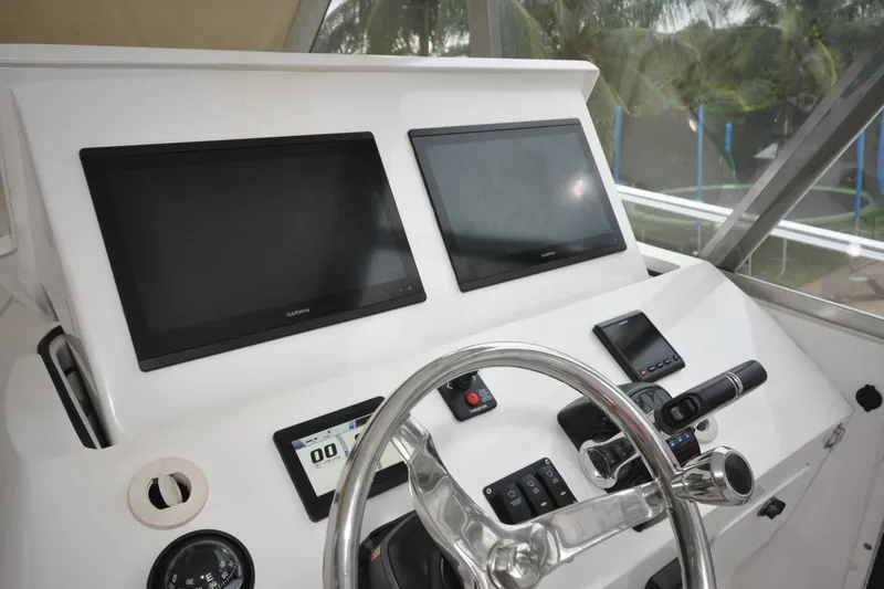 Slide: The Image of Helm of 2009 Intrepid 430 Sport Yacht with dual Garmin displays and steering wheel. - 3