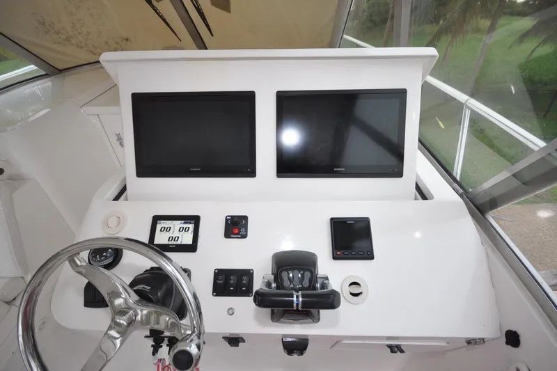 Slide: The Image of Helm of 2009 Intrepid 430 Sport Yacht with dual Garmin displays and steering wheel. - 5