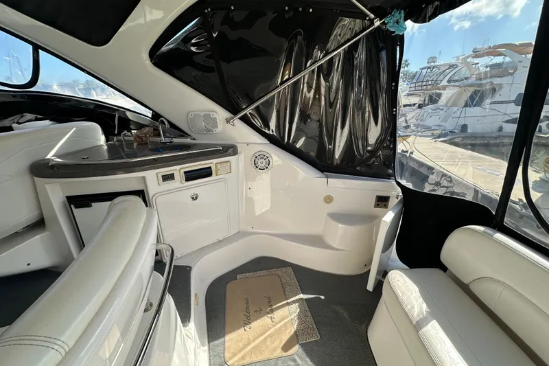 Slide: The Image of Interior of 2008 Regal Commodore 4060 yacht with seating and kitchenette. - 22