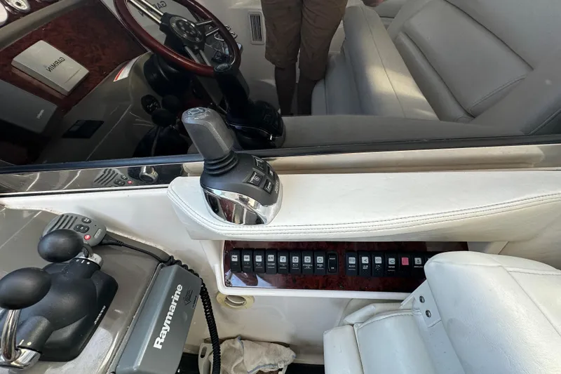 Slide: The Image of Interior of 2008 Regal Commodore 4060 boat with control panel and steering wheel. - 29