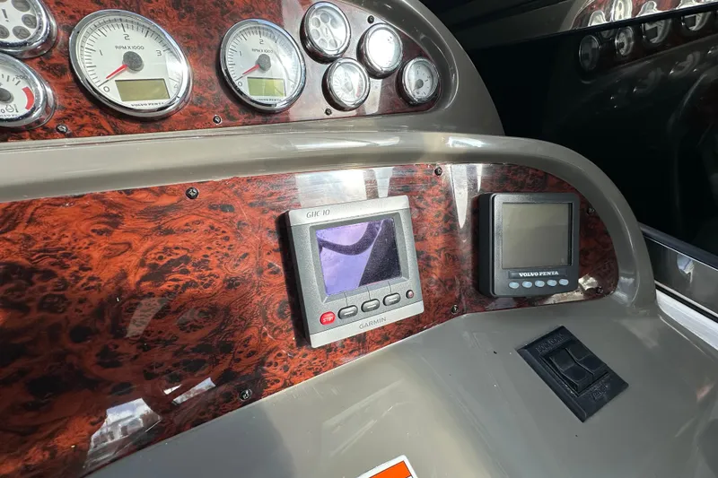 Slide: The Image of Dashboard of 2008 Regal Commodore 4060 with gauges and navigation displays. - 32