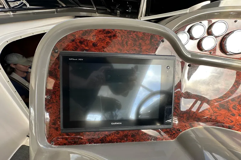 Slide: The Image of Garmin GPS display on 2008 Regal Commodore 4060 yacht dashboard with wood paneling. - 33