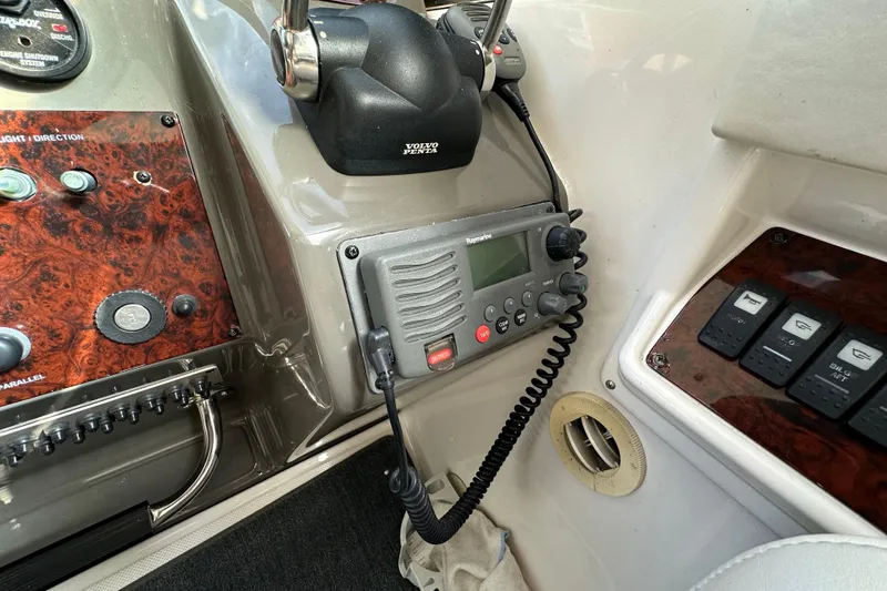 Slide: The Image of Control panel of a 2008 Regal Commodore 4060 boat with radio and switches. - 34