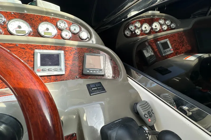 Slide: The Image of 2008 Regal Commodore 4060 dashboard with gauges, Garmin and Volvo Penta displays. - 35
