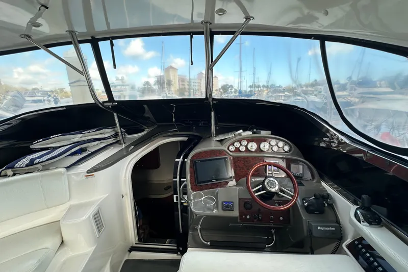 Slide: The Image of 2008 Regal Commodore 4060 yacht cockpit with steering wheel and navigation instruments. - 37