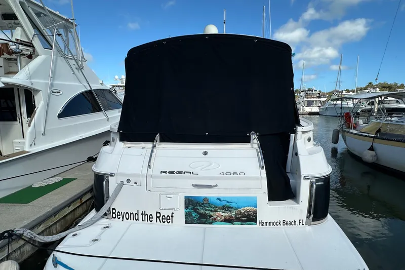 Slide: The Image of 2008 Regal Commodore 4060 yacht docked at marina, Hammock Beach, FL. - 4