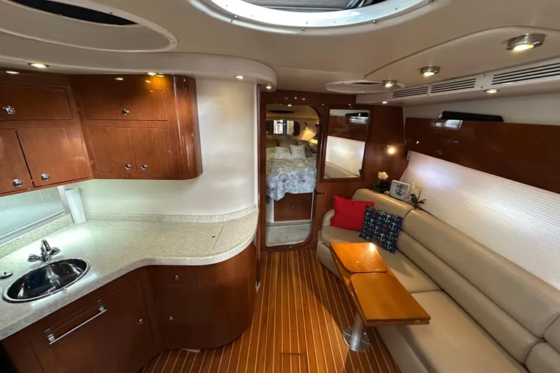 Slide: The Image of Luxurious interior of 2008 Regal Commodore 4060 yacht with elegant wood finishes and cozy seating. - 44