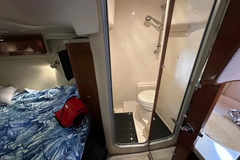 Slide: The Image of Interior of 2008 Regal Commodore 4060 yacht with bed and compact bathroom. - 54