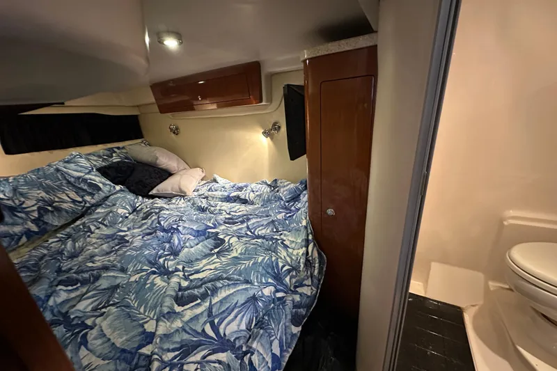 Slide: The Image of 2008 Regal Commodore 4060 cabin interior with bed and bathroom. - 55