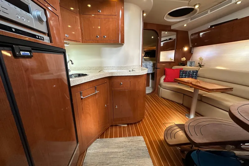 Slide: The Image of Luxurious 2008 Regal Commodore 4060 yacht interior with elegant wood finishes and cozy seating. - 58