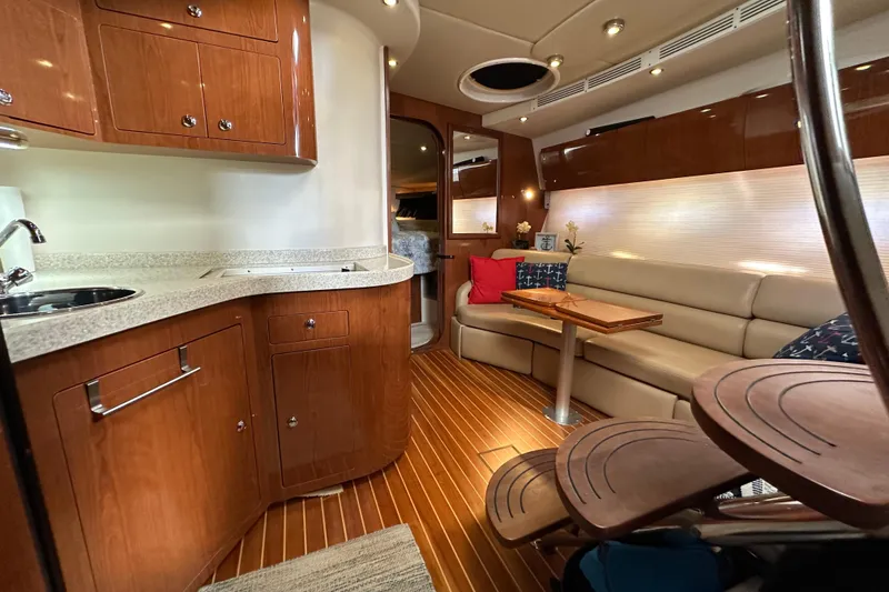 Slide: The Image of Luxurious interior of 2008 Regal Commodore 4060 yacht with wood finishes and cozy seating. - 59