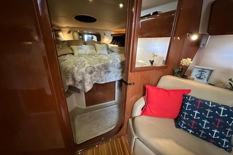 Slide: The Image of Luxurious interior of 2008 Regal Commodore 4060 yacht with cozy bedroom and elegant decor. - 61