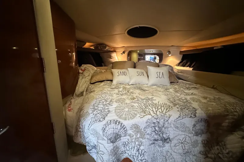 Slide: The Image of Interior cabin of 2008 Regal Commodore 4060 yacht with cozy bedding and decorative pillows. - 62
