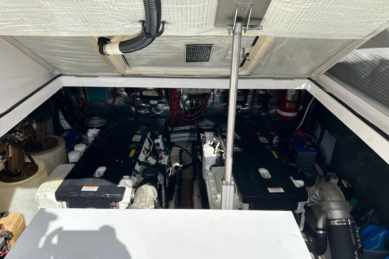 Slide: The Image of Engine compartment of 2008 Regal Commodore 4060 boat, showcasing dual engines and mechanical components. - 65