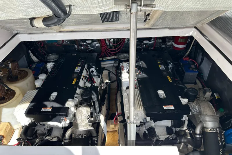 Slide: The Image of Engine compartment of a 2008 Regal Commodore 4060 boat, showcasing dual engines and wiring. - 66