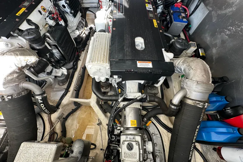 Slide: The Image of Engine compartment of a 2008 Regal Commodore 4060 boat, featuring Volvo Penta components. - 70