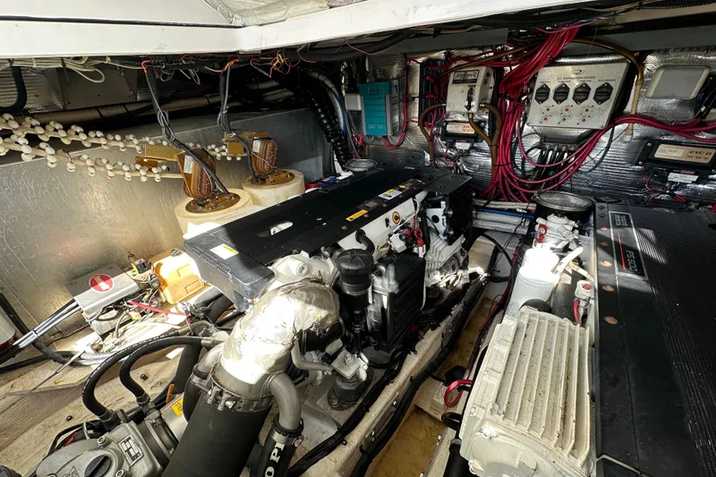 Slide: The Image of Engine room of 2008 Regal Commodore 4060 with complex wiring and machinery. - 71