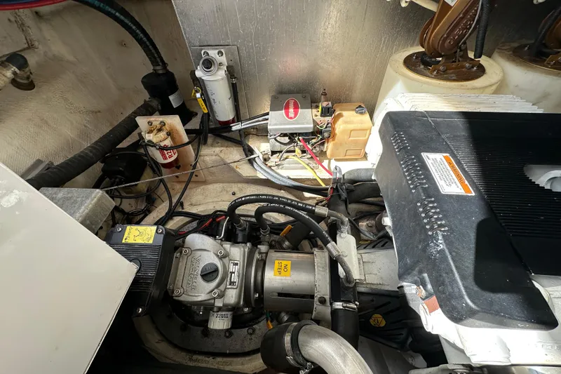 Slide: The Image of Engine compartment of 2008 Regal Commodore 4060 boat, showcasing mechanical components and wiring. - 72