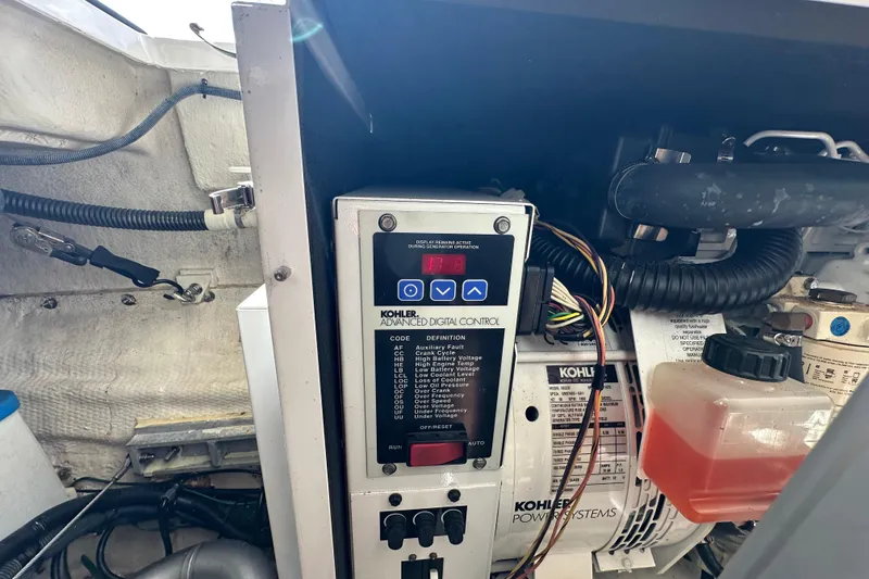 Slide: The Image of Kohler generator control panel in a 2008 Regal Commodore 4060 boat engine room. - 75