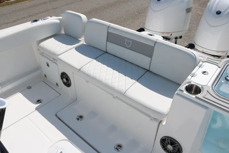 Slide: The Image of 2026 Sea Fox 268 Commander boat interior with white cushioned seating and dual Yamaha engines. - 12