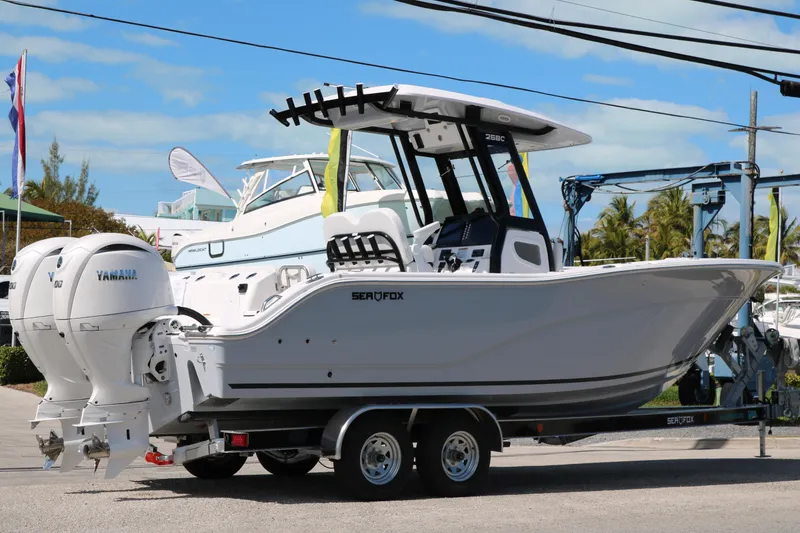 Slide: The Image of 2026 Sea Fox 268 Commander boat on trailer with dual Yamaha engines. - 3
