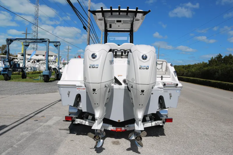 Slide: The Image of 2026 Sea Fox 268 Commander with dual Yamaha 200 engines, parked on a trailer. - 4
