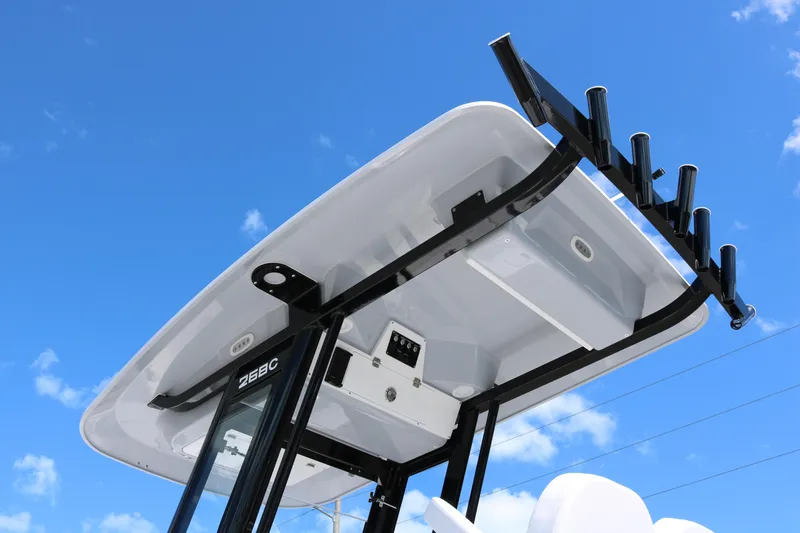 Slide: The Image of 2026 Sea Fox 268 Commander boat top against a clear blue sky. - 5