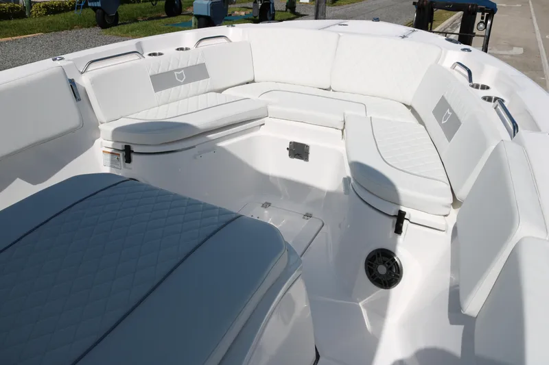Slide: The Image of 2026 Sea Fox 268 Commander boat interior with white cushioned seating. - 6