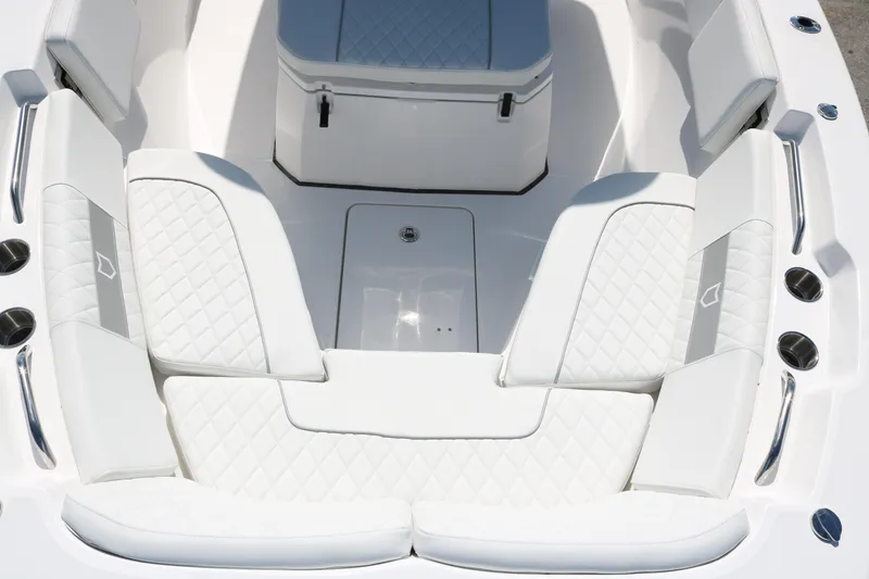 Slide: The Image of Luxurious seating area on 2026 Sea Fox 268 Commander boat, featuring quilted white upholstery. - 7